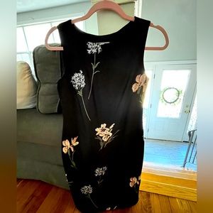 Calvin Klein size 2 black with embroidered pastel flowers. Worn once. Tea length